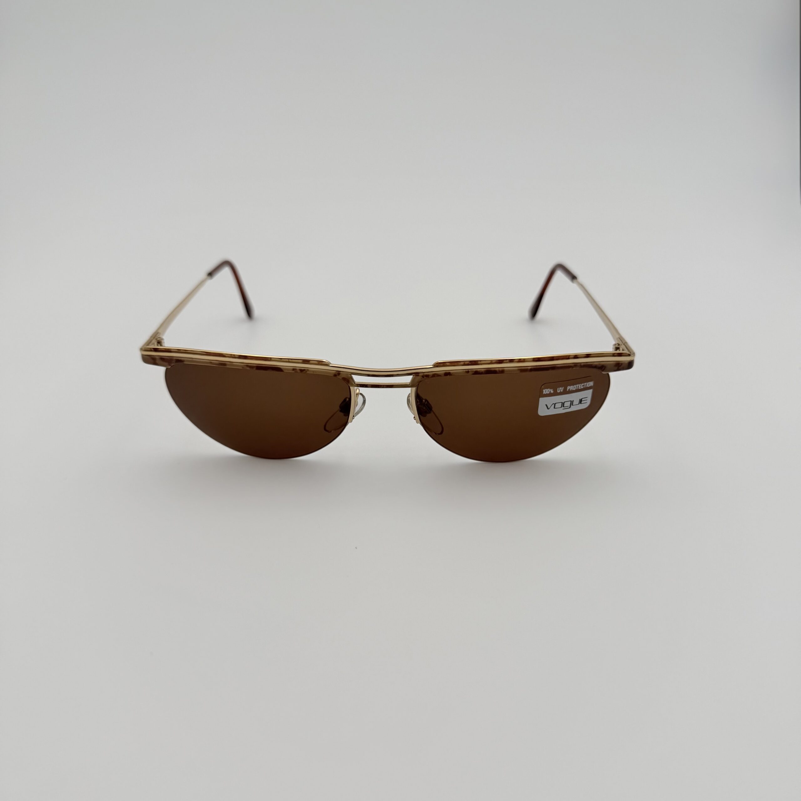 Occhiali da Sole Vogue VO3040 d’Epoca – Silhouette Frameless Avvolgente & Lenti Marroni